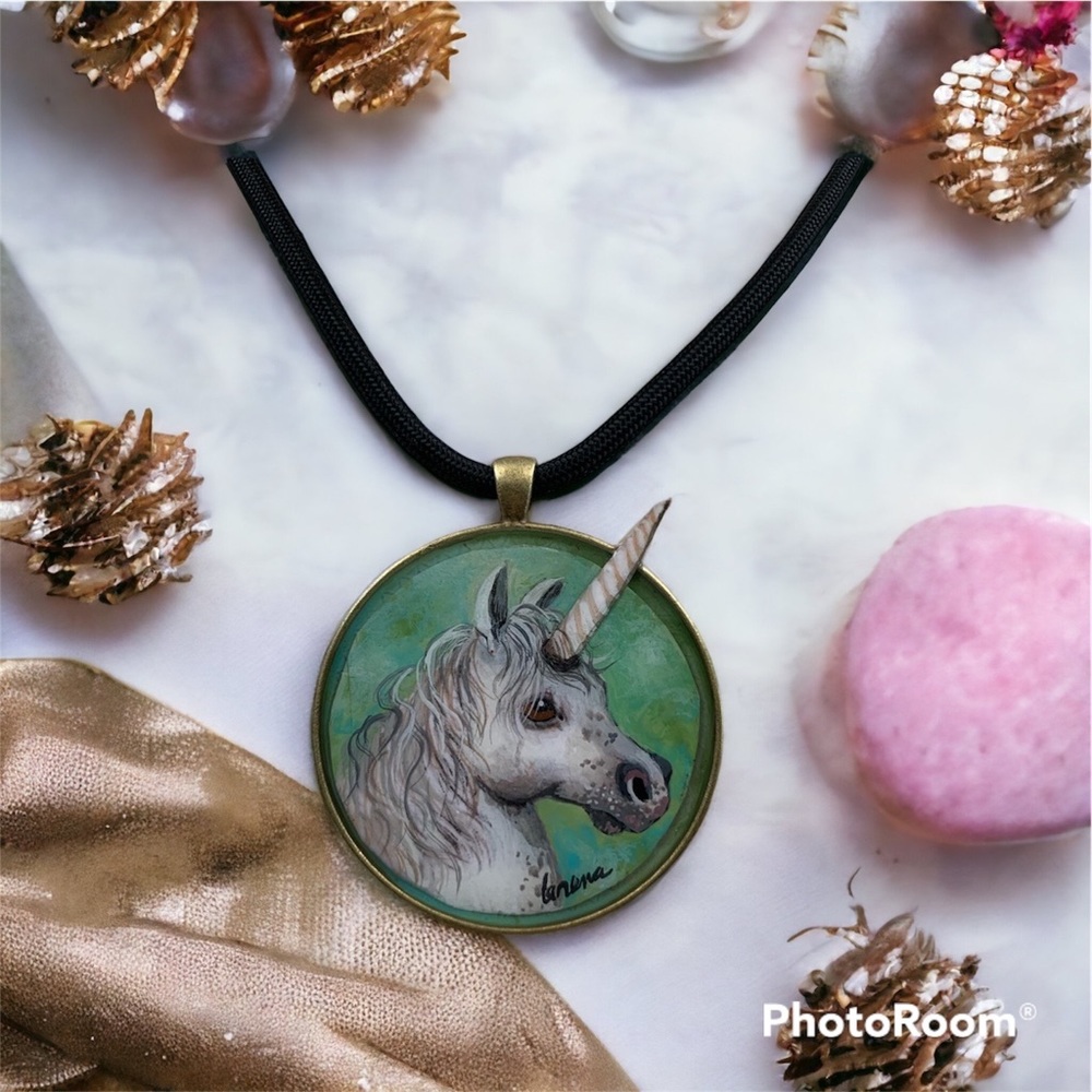 Handpainted Unicorn pendant in 50mm brass bezel on basic parachute cord